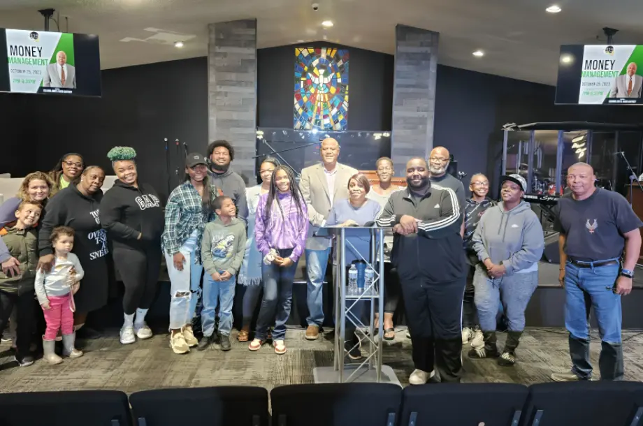 Group photo inside a church meeting room.